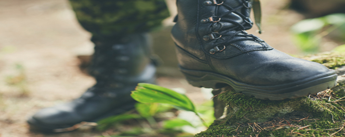 war, hiking, army and people concept - close up of soldier feet