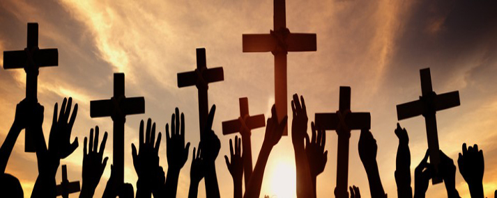 group-of-people-holding-cross-and-praying-in-back-lit-s-960x250.jpg